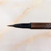 Close-up of the Dazzle Carat Liquid Eyeliner brush tip in Brown