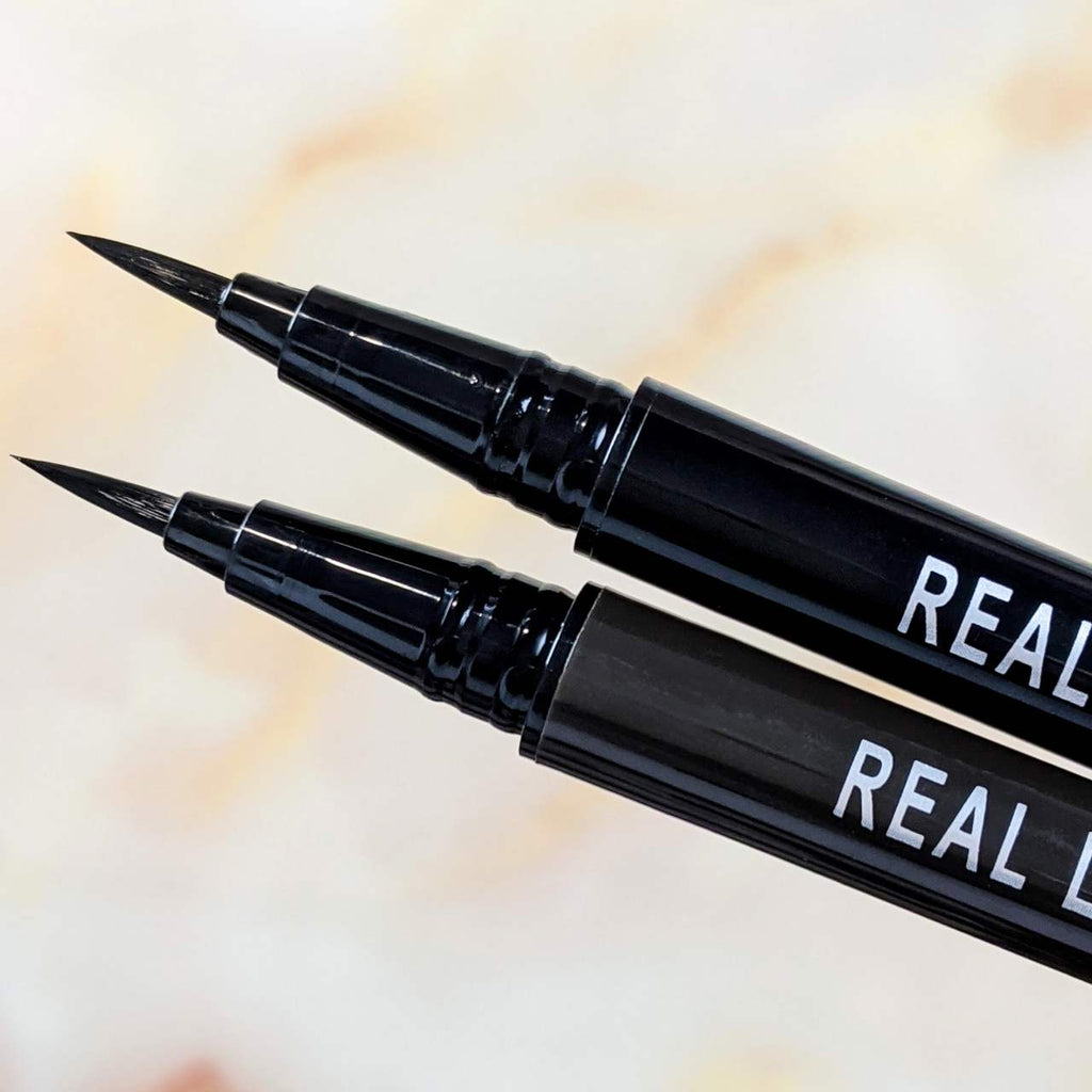 Close-up of the K-Palette 1 Day Tattoo Real Lasting Liquid Eyeliner brush tips in Brown (below) and Black (above)